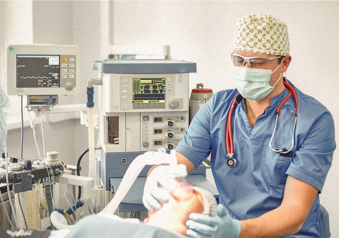 Anesthesiologist working with a patient